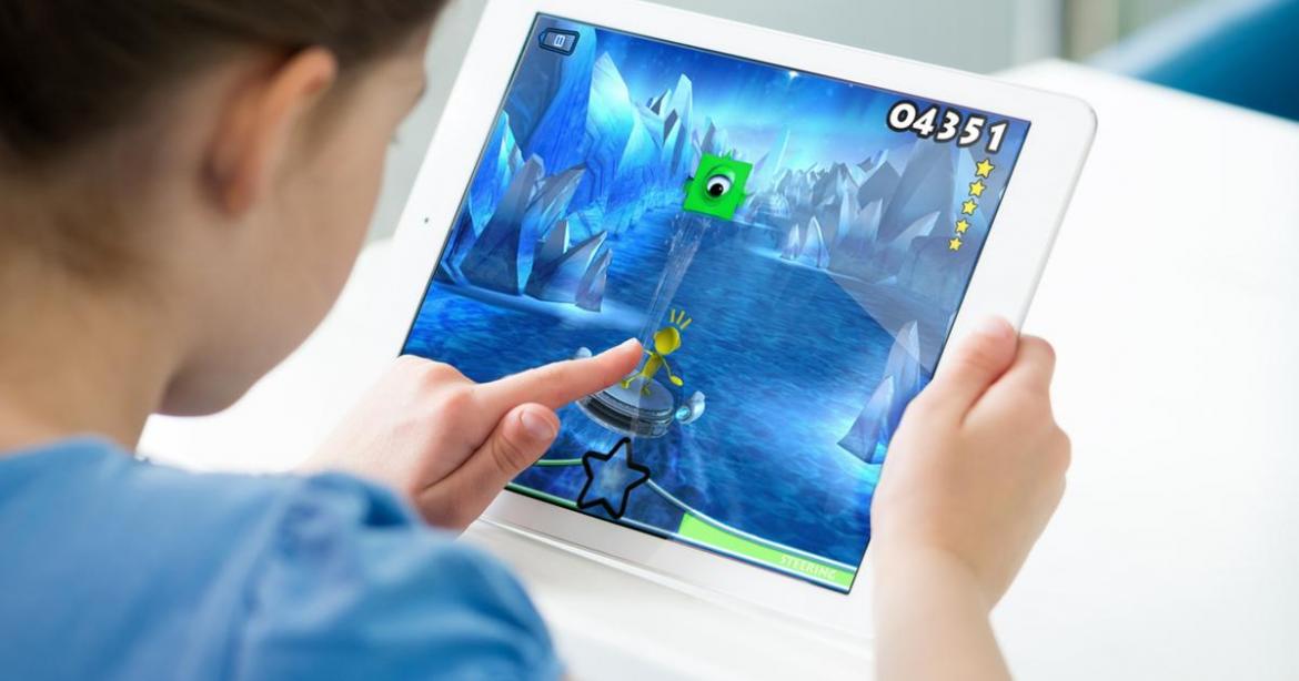 Child playing game on iPad