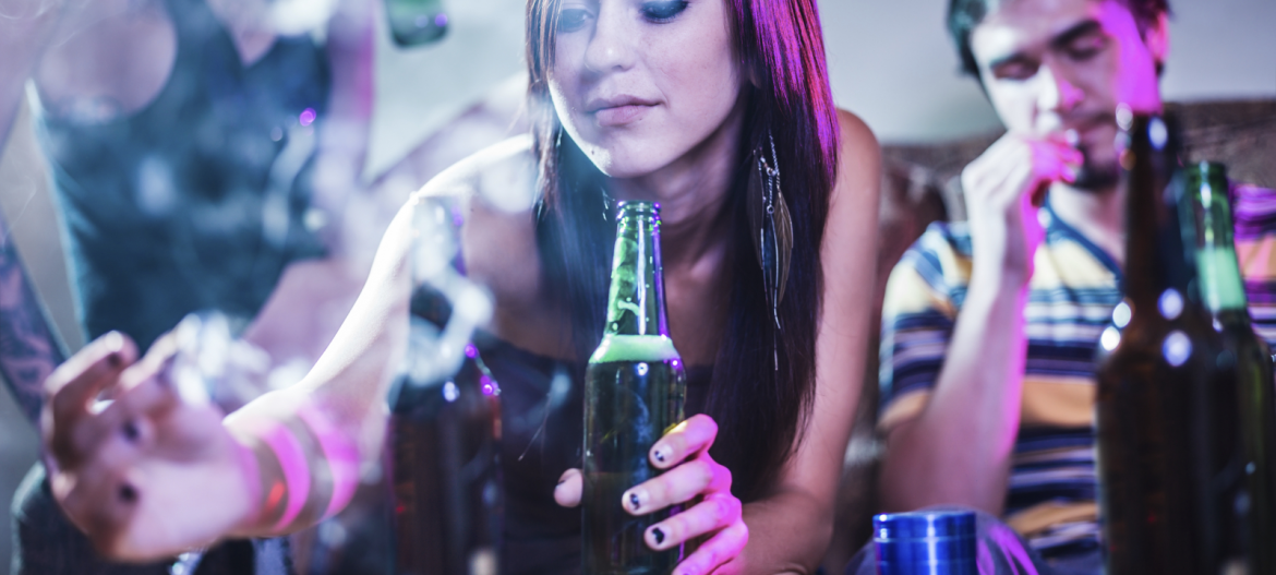 Teenage girl drinking and smoking
