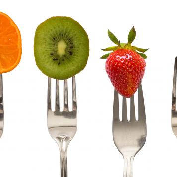 Fruits and vegetables on forks