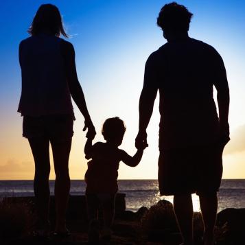 Silhouettes of a child and parents
