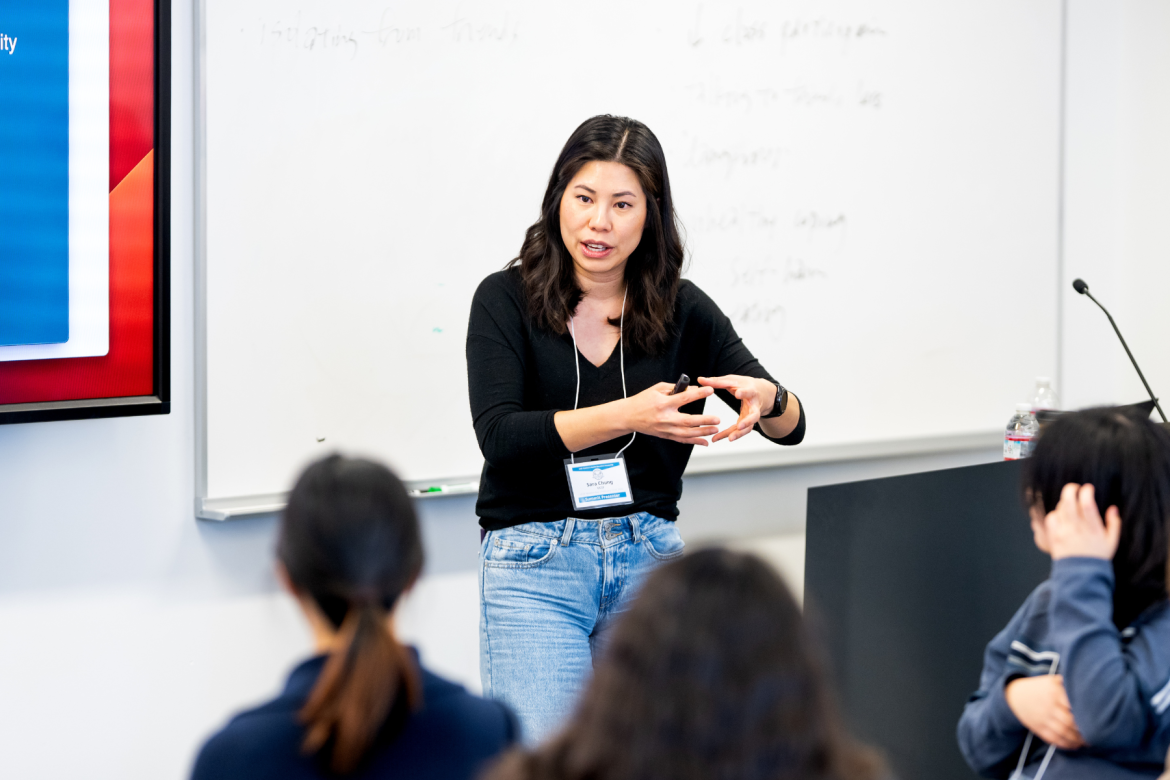 Person teaching to classroom filled with students