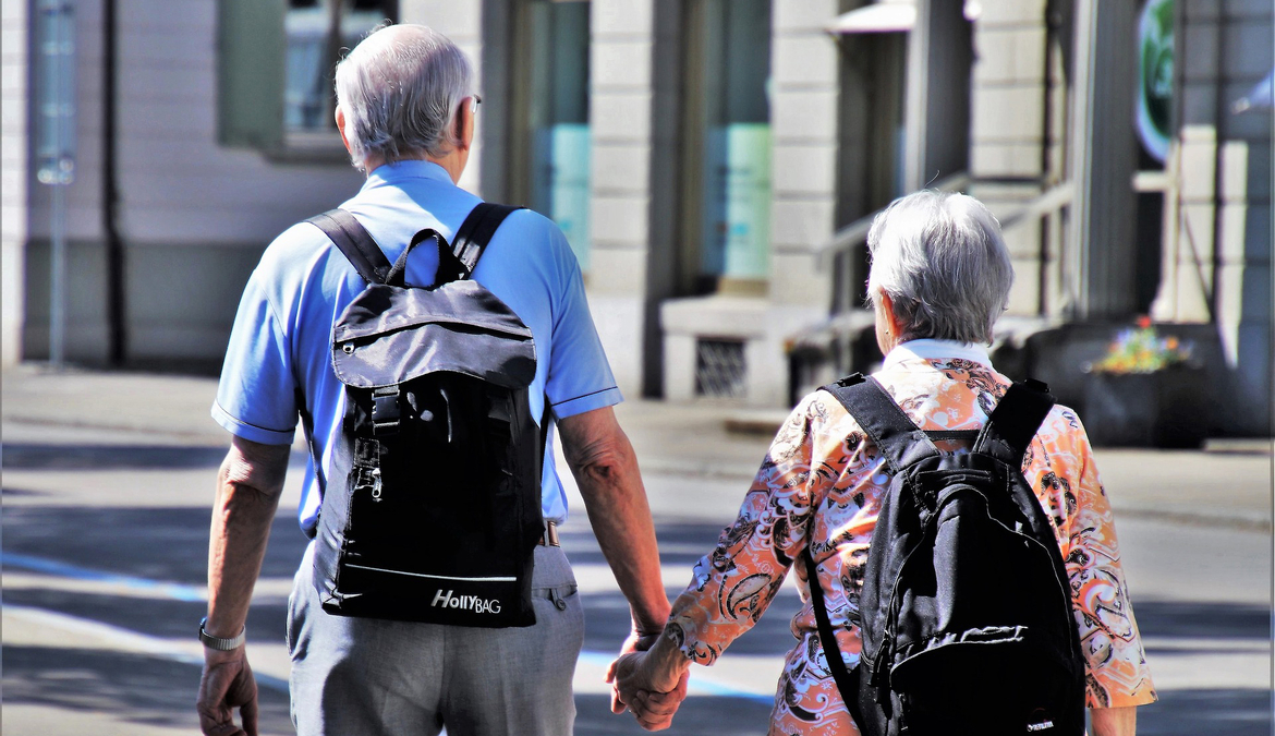 Senior couple holding hands