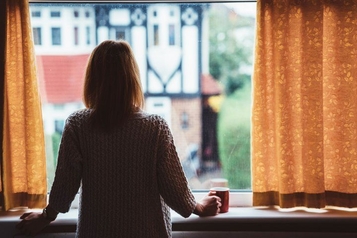 Woman looking out a window