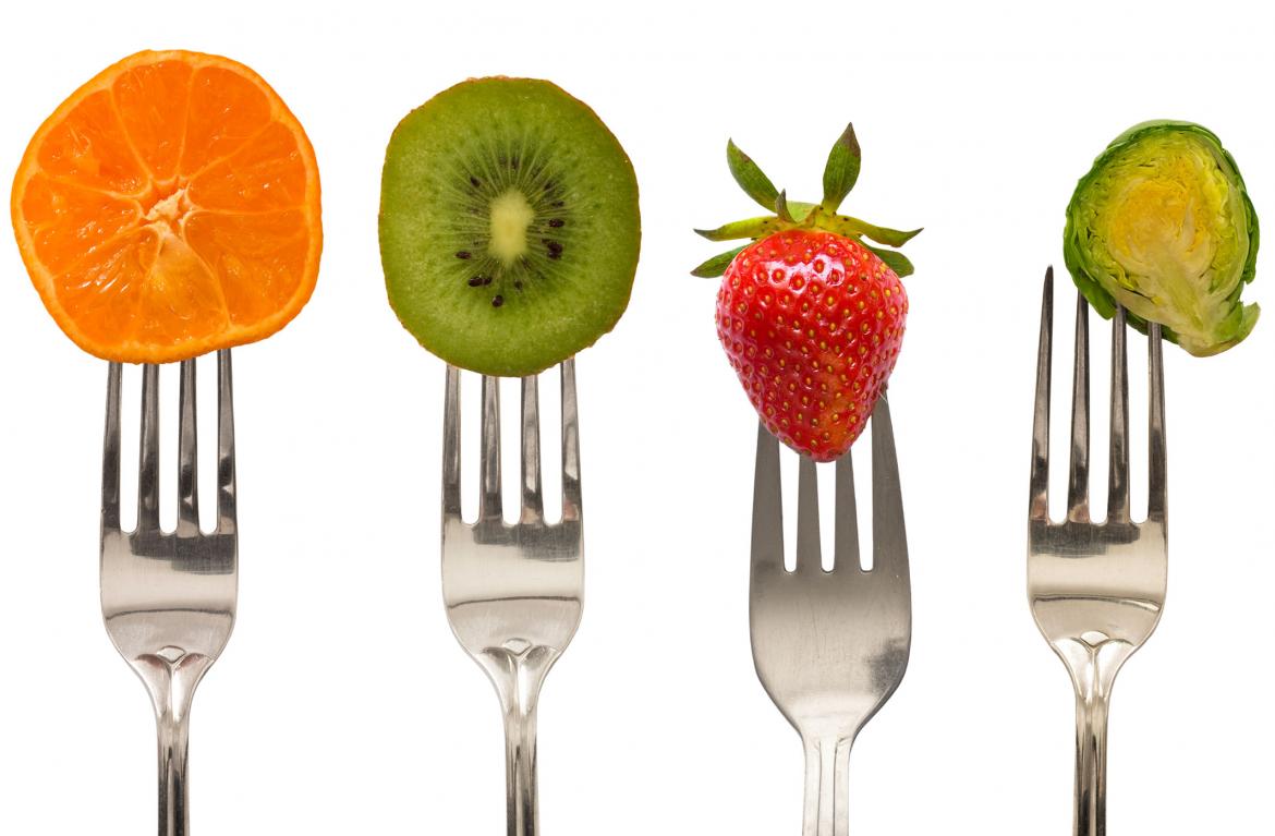 Fruits and vegetables on forks