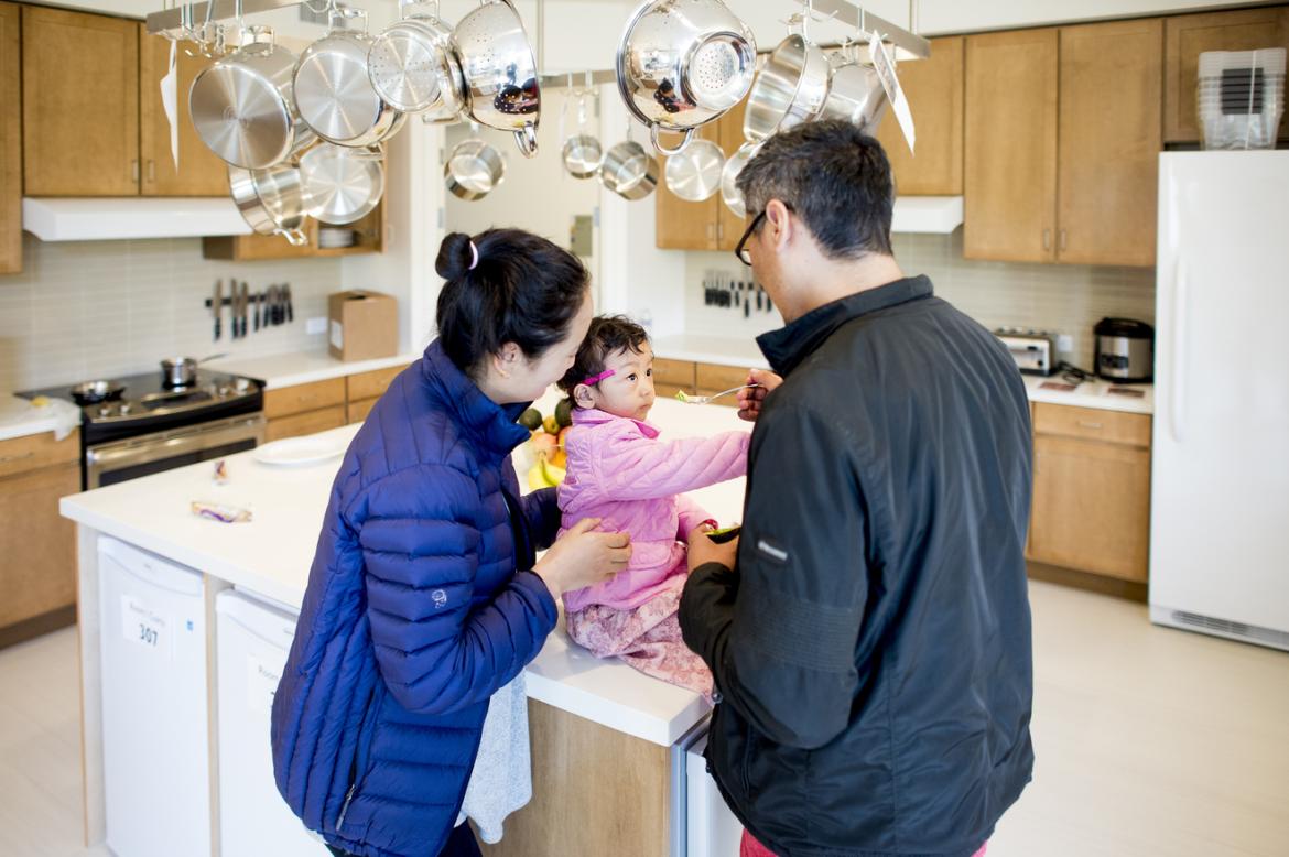 Parents with child in their kitchen