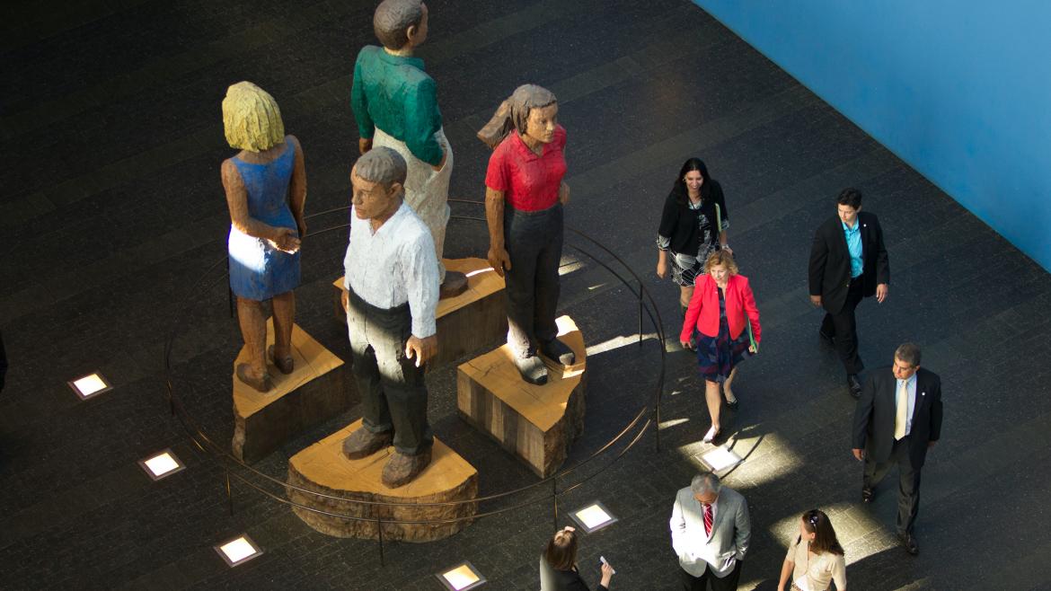 Large statues of people in the Rutter Center on the UCSF Mission Bay campus