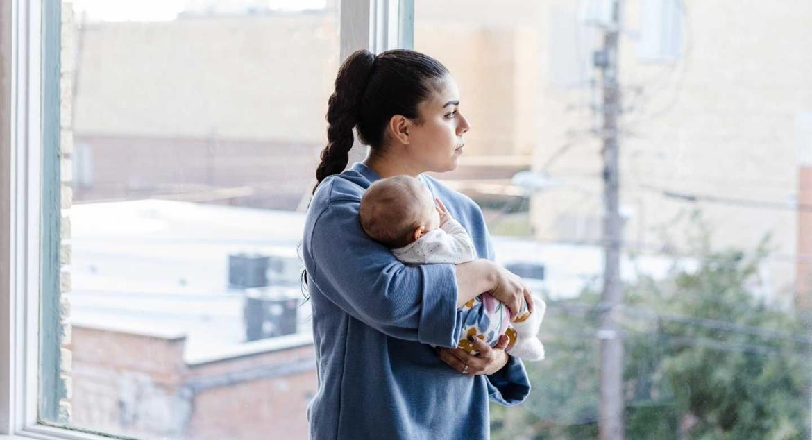 mother holding baby