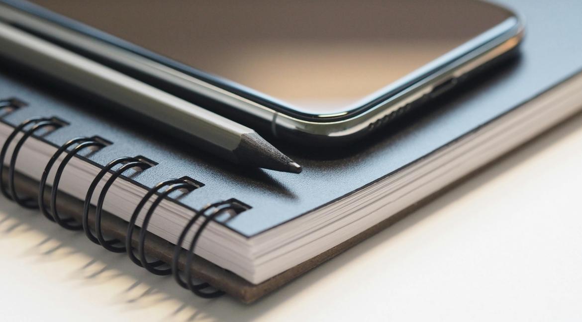 photo of a phone on top of a journal