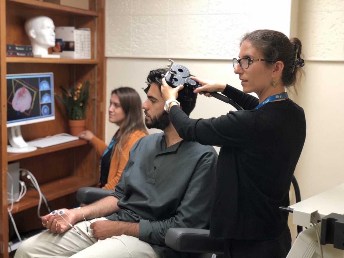 Katherine Scangos, MD overseeing transcranial magnetic stimulation