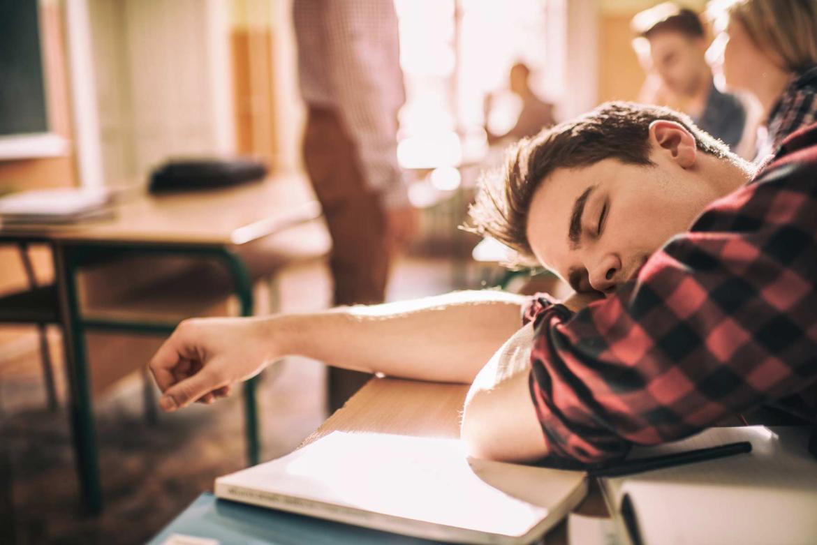 photo of teen sleeping in class