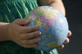 Child holding globe