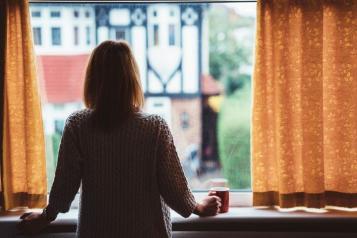 Woman looking out a window