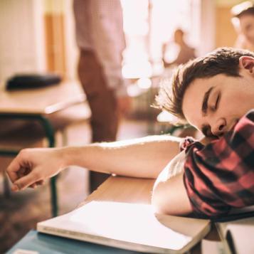 Photo of teen sleeping in class